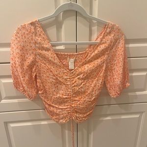Orange floral print puff sleeve crop top